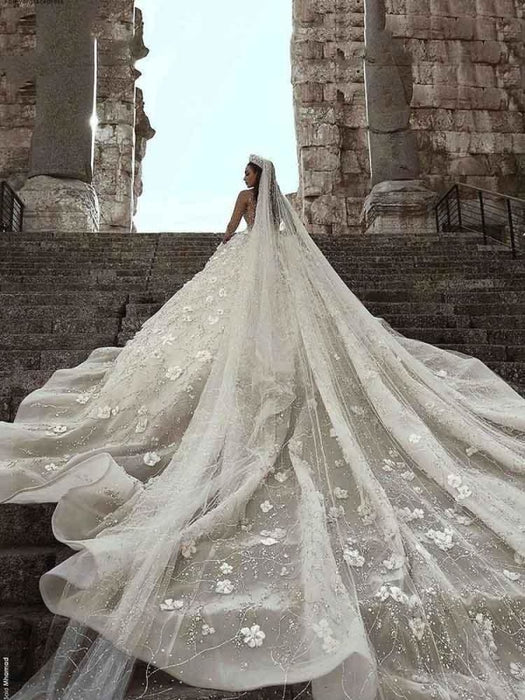 https://www.bridelily.com/cdn/shop/products/luxury-long-sleeve-v-neck-royal-ball-gown-wedding-dresses-462_525x700.jpg?v=1630019154