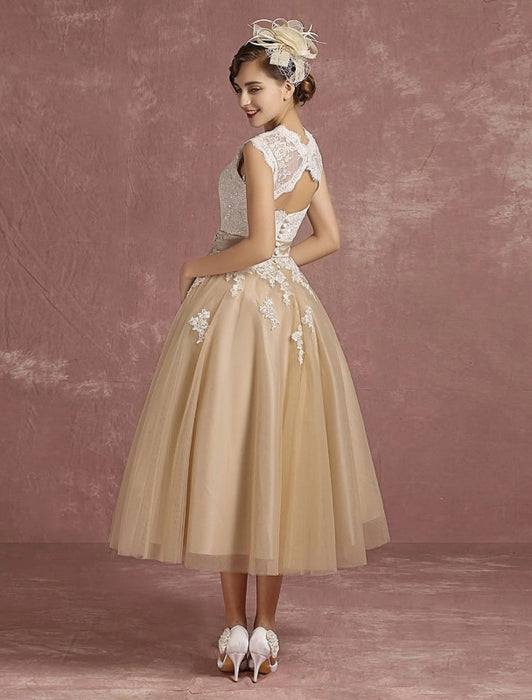 Decadent and opulent champagne vintage tea length wedding dress.