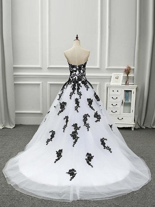 white and black princess wedding dresses